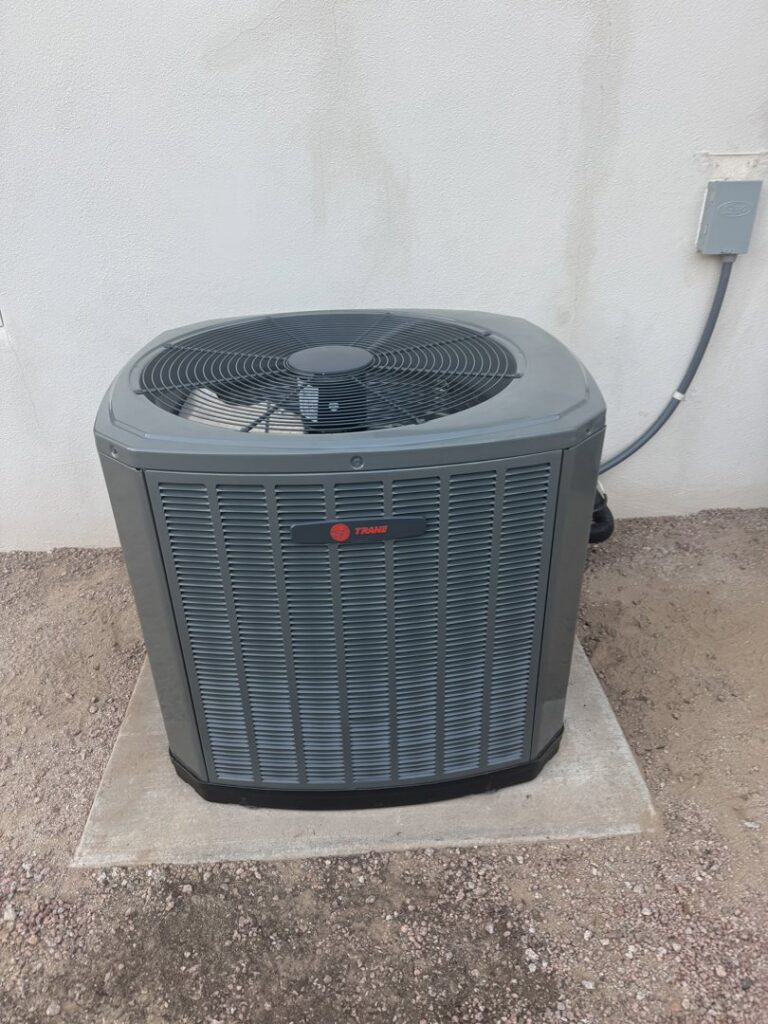 A new Trane outdoor AC unit installed on a concrete pad, representing HVAC installation services by State 48 Home Comfort LLC in Peoria, AZ.