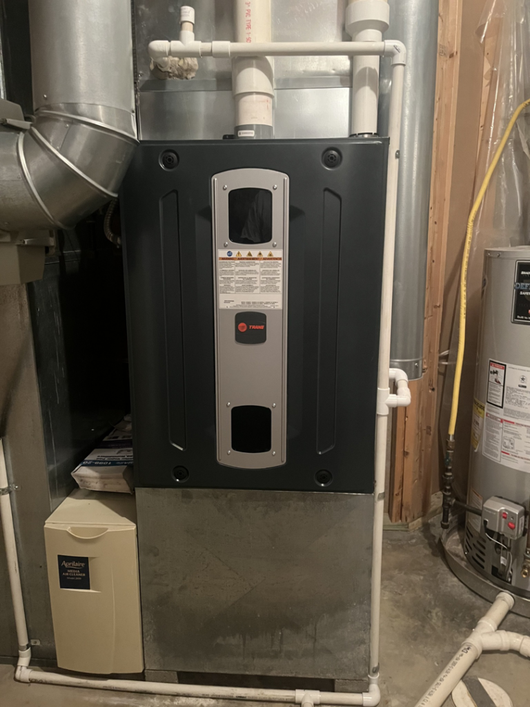 A newly installed Trane furnace with ductwork and an Aprilaire humidifier by Tri County Heating and Cooling in Longmont, CO.
