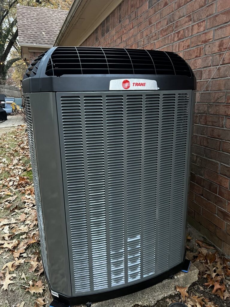 A newly installed Trane outdoor AC condenser unit by C&K Air and Heating, Inc. in Olive Branch, MS.