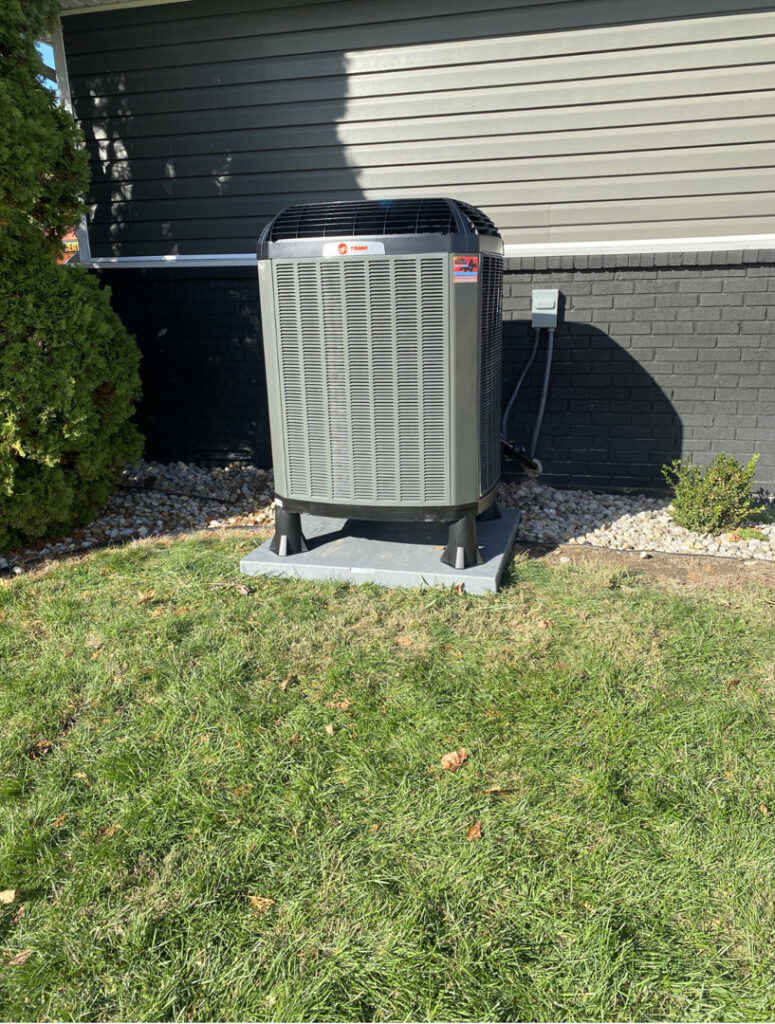 A newly installed Trane outdoor air conditioning unit by Roy Rogers Heating and Air in Indianapolis, IN.