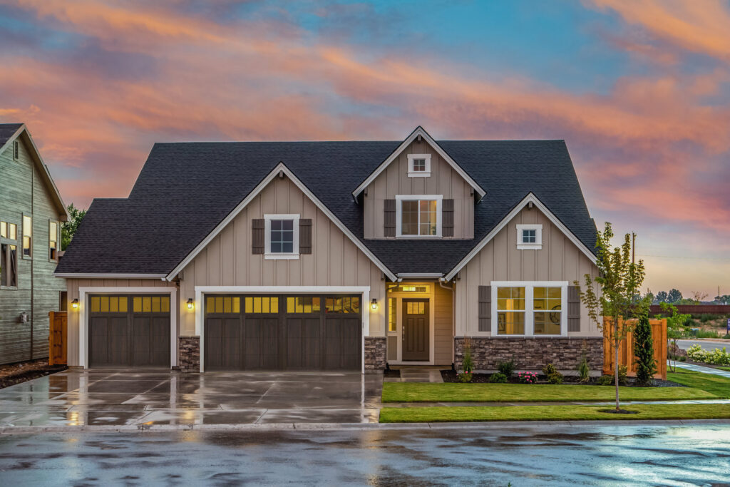 A modern house featuring two newly installed garage doors by Colorado Garage Door Guy in Aurora, CO.