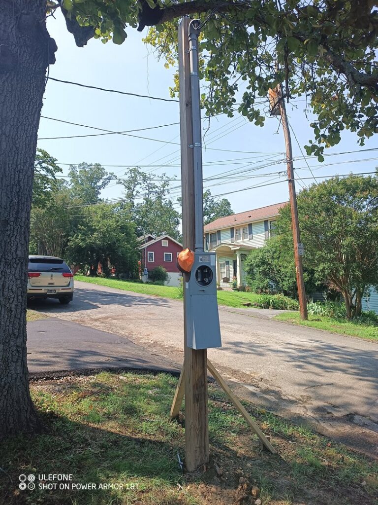 A new utility pole with an electrical meter and conduit installation by Elemental Electrical in Chattanooga, TN.