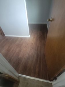 A view of a room with newly installed vinyl plank flooring by Harper's Floor's in Columbus, OH.