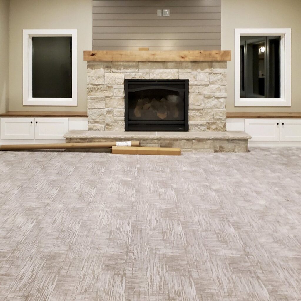 New wall-to-wall carpet installation in a living room by Bryer Carpet & Blinds in Lincoln, NE