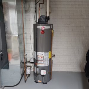 A newly installed water heater next to HVAC ductwork, showcasing services by Thrasher Service Corp in Des Moines, IA.
