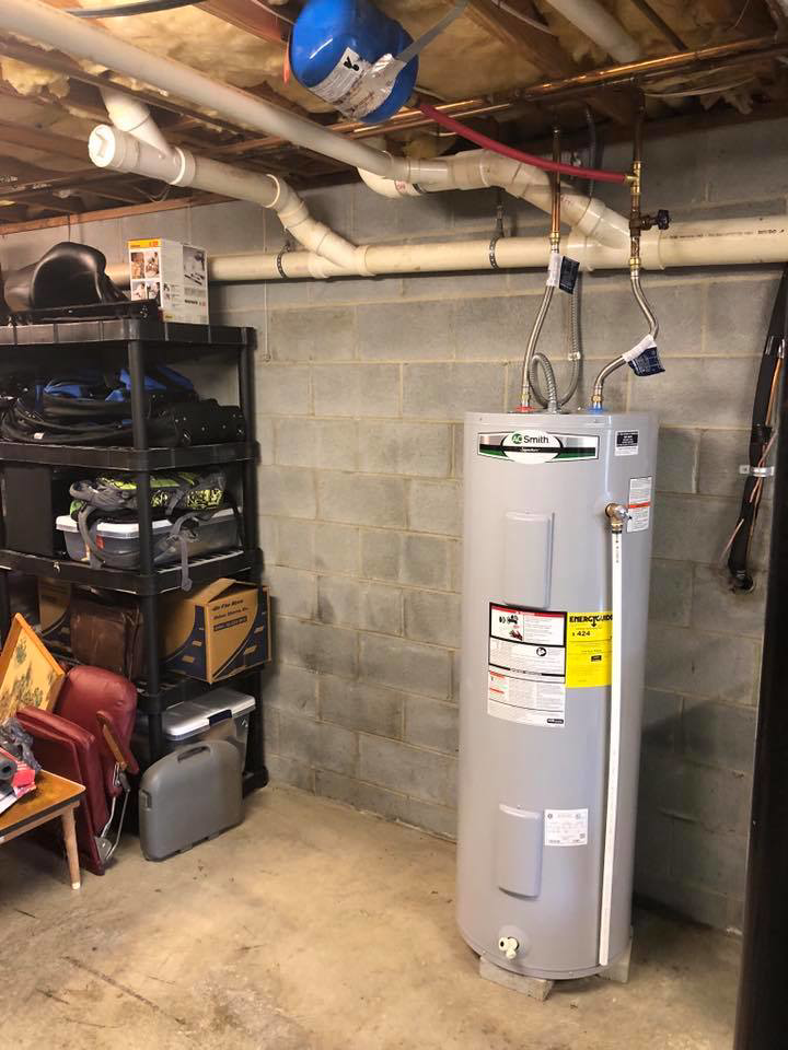 A new water heater installation in a basement by G&G Heating and Air, providing service in Portage, MI.