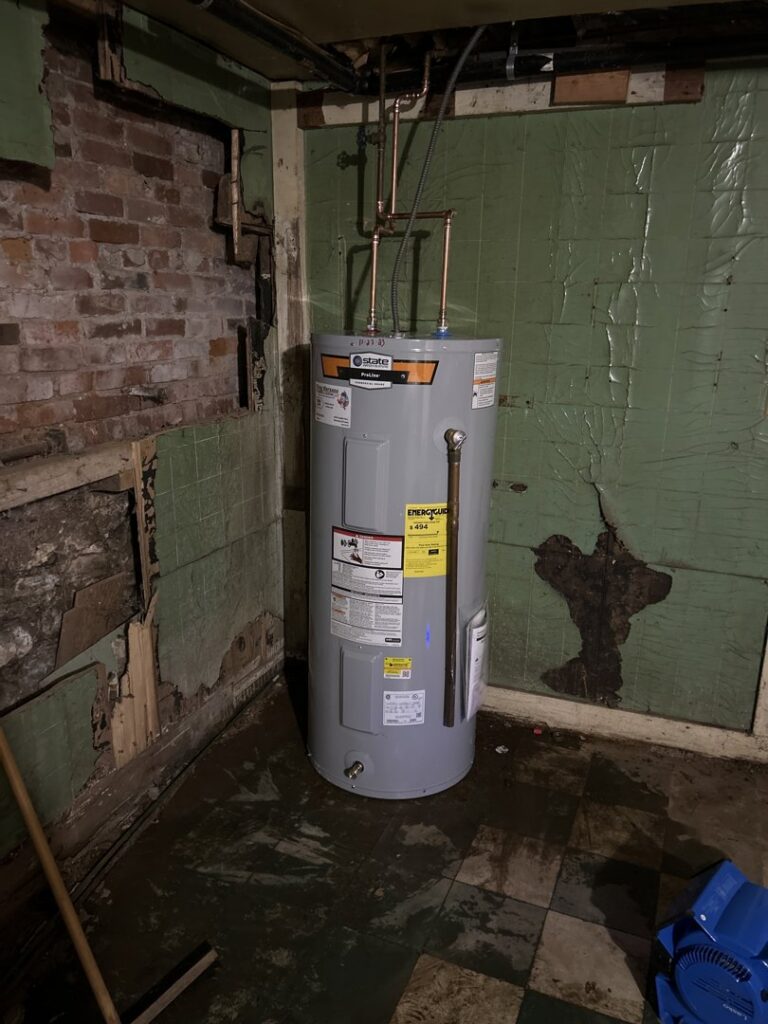 A newly installed water heater in a basement by Tony Marzano Plumbing & Heating LLC in Hartford, CT.