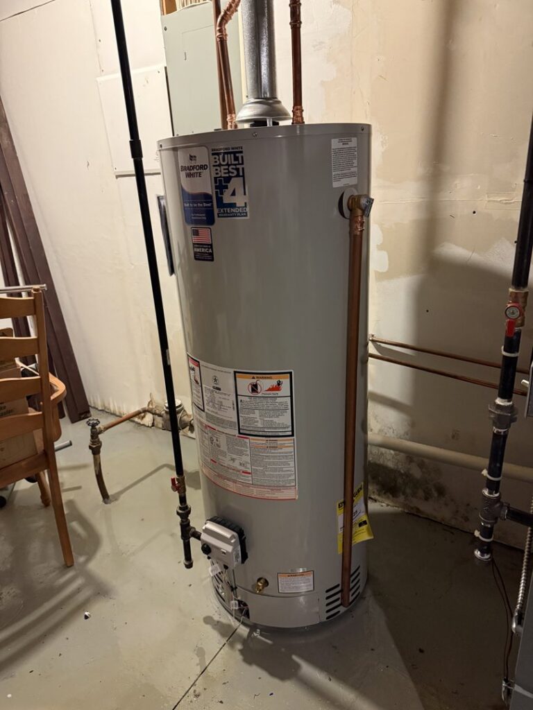 A newly installed water heater in a utility room, a heating service provided by Service Legends in Des Moines, IA.