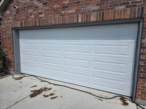 A pristine white garage door recently installed by Legacy Garage Doors & Repairs in Church Point, LA.