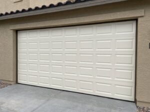 A newly installed white paneled garage door on a residential home by MGG Garage Door Service in San Tan Valley, AZ