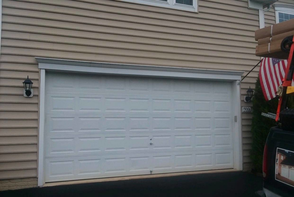 A new white residential garage door installed by Midland Glass and Garage Doors in Frederick, MD