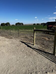 New wire fence installation with wooden and T-posts by Cowboy State Fencing LLC in Riverton, WY.