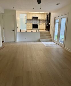 Beautiful new wood-look flooring installed in a living area by Keystone Carpet & Tile in Omaha, NE.