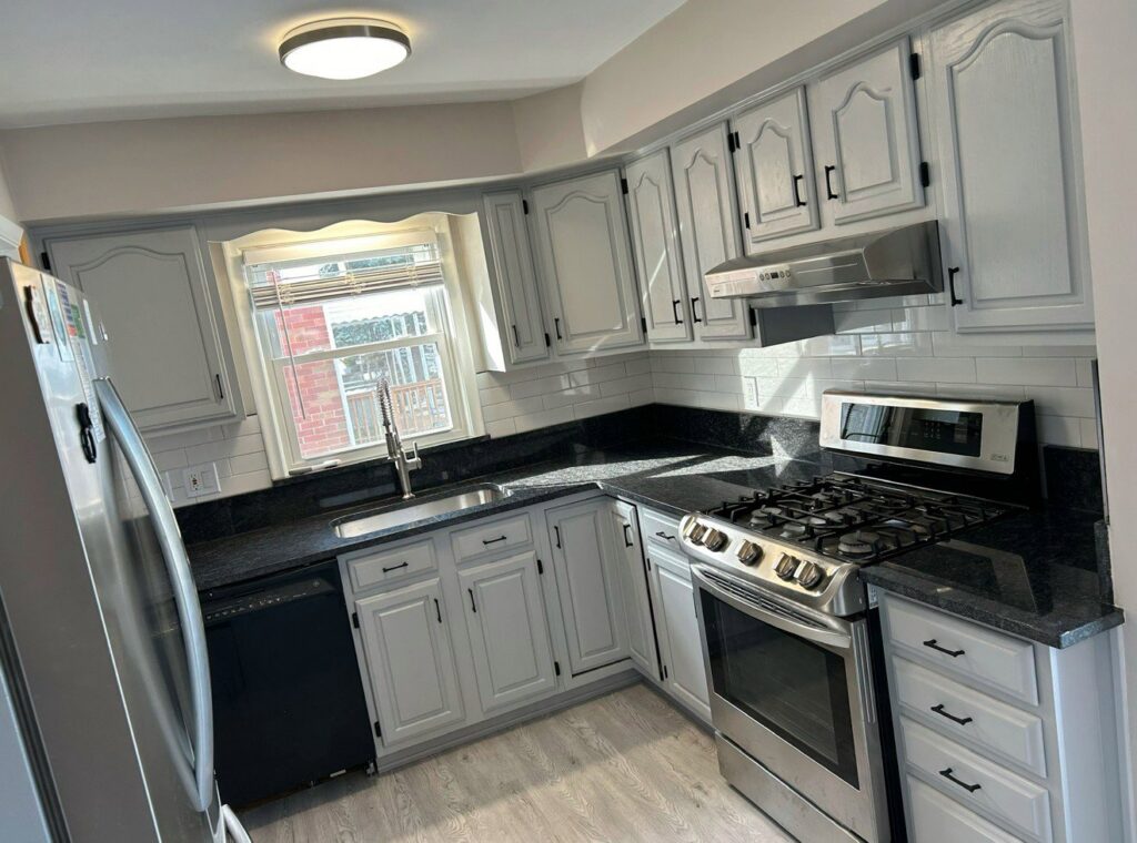 Renovated kitchen featuring new wood-look flooring installed by Nations Best Flooring & Carpet Co. in Livonia, MI.