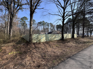 A new wood privacy fence installed along a roadside by Mayan Fence & Outdoor LLC in Phoenix, AZ.
