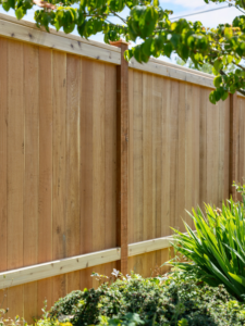 A newly installed wood privacy fence with a top rail, expertly built by Alpine Fencing in Everett, WA.