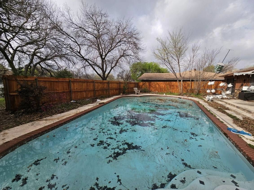 A new wood privacy fence installed around a residential pool by Straight Shot Solutions, LLC in Fort Worth, TX.