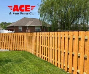 A newly installed wood privacy fence in a residential backyard by ACE and Sons Fence Company in Evansville, IN.