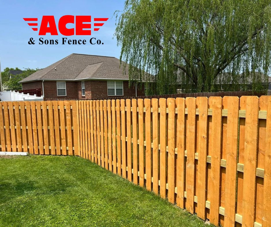 A newly installed wood privacy fence in a residential backyard by ACE and Sons Fence Company in Evansville, IN.
