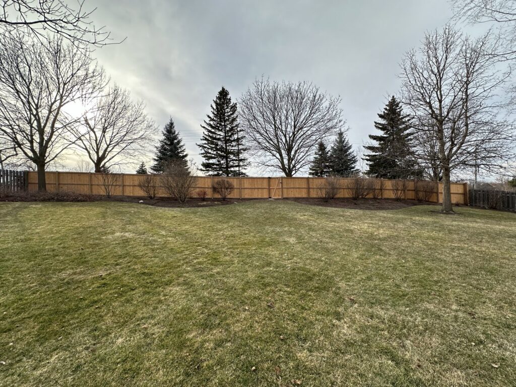 New wood privacy fence installed in a residential backyard by All Terrain Fence LLC in Waukegan, IL