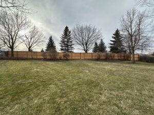 New wood privacy fence installed in a residential backyard by All Terrain Fence LLC in Waukegan, IL