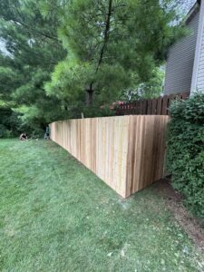 A newly installed wood privacy fence in a residential backyard by Central Ohio Fence in Newark, OH.