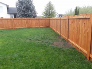 A newly installed wooden privacy fence enclosing a residential backyard by The Best Fence Company in Spokane, WA.