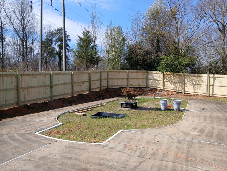 A newly installed wood privacy fence enclosing a backyard area by Top Rail Fence Birmingham, AL