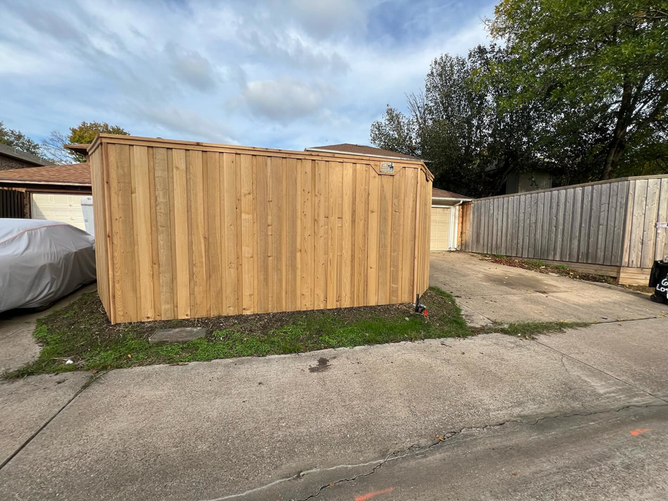 A newly installed wooden privacy fence along a property line, showing a completed project by True Ways Services LLC in Mesquite, TX.