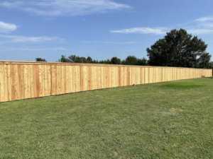 A newly installed wood privacy fence by DB Construction in Fort Smith, AR.