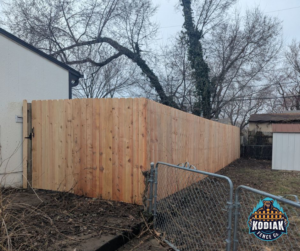 A newly installed wood privacy fence by Kodiak Fence Co. in Flower Mound, TX, enhancing a residential property.