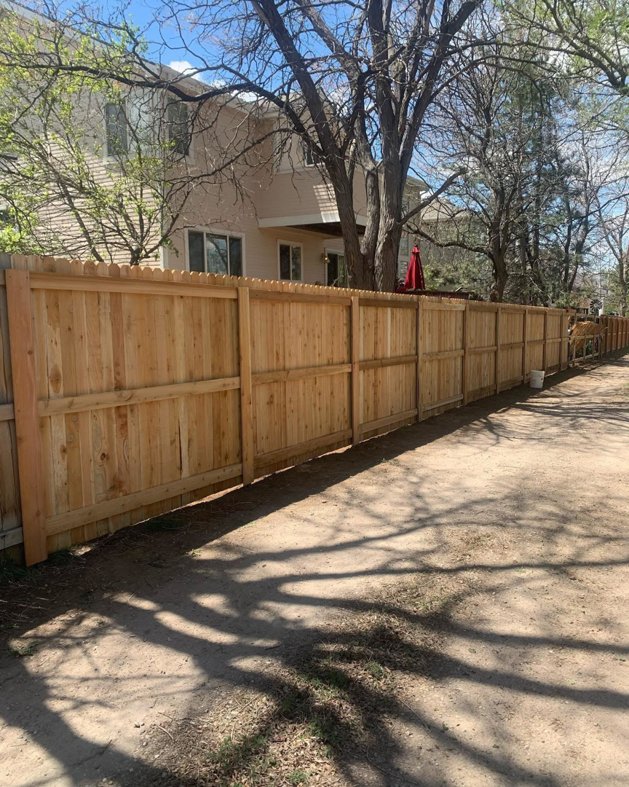 A newly installed wood privacy fence by Solid Fence LLC, providing security and aesthetics in Golden, CO.