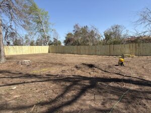 A new wood privacy fence installed on a large property by CSRA Solutions in Jackson, SC.