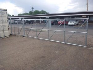 A newly installed section of wooden privacy fence replacing an old, weathered fence, demonstrating repair work by Best Boy's Fencing in Fort Collins, CO.