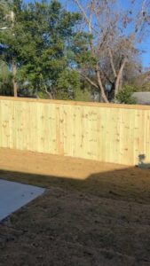 A newly installed wood privacy fence in a residential area by East Georgia Fence in Evans, GA.