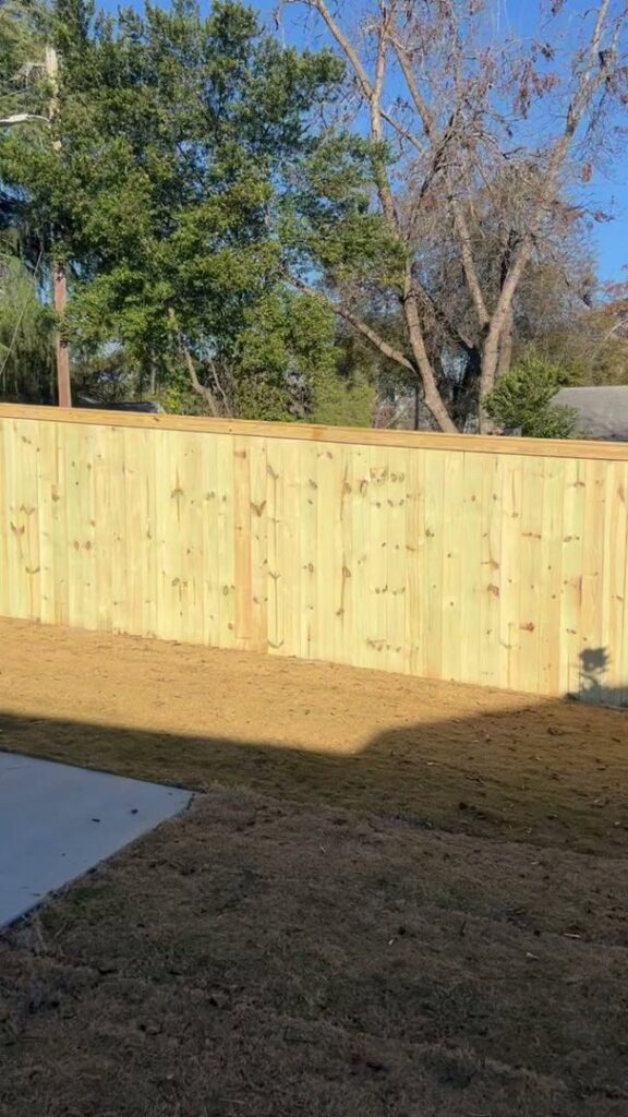 A newly installed wood privacy fence in a residential area by East Georgia Fence in Evans, GA.