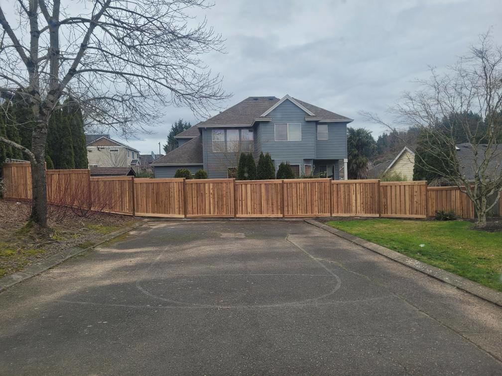 A newly installed wood privacy fence surrounding a residential property by Howell Fence Inc. in Oregon City, OR.