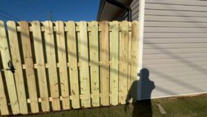 A newly installed wood privacy fence along a residential property by East Georgia Fence in Evans, GA.