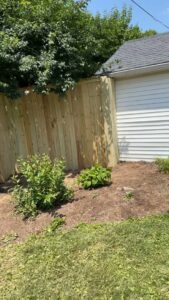 A newly installed wood privacy fence alongside a residential home by Shatkoff Fencing in Louisville, KY.