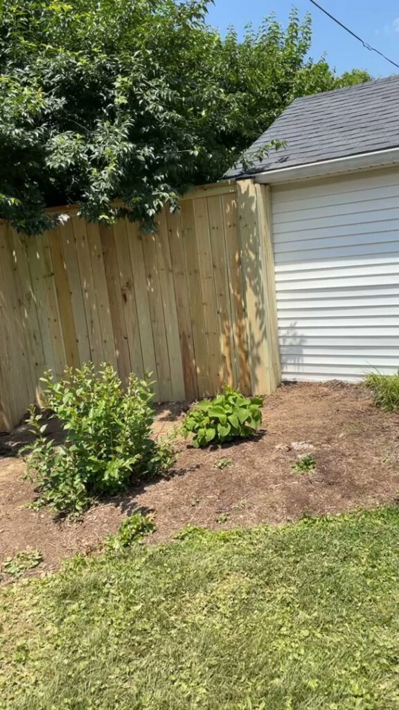 A newly installed wood privacy fence alongside a residential home by Shatkoff Fencing in Louisville, KY.