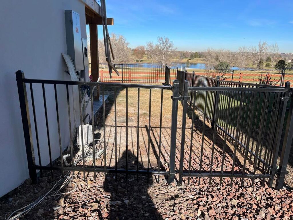 A long, newly installed wood privacy fence along a residential property by Supreme Fencing Denver, CO.