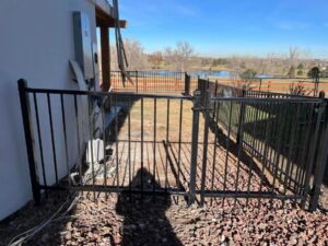 A long, newly installed wood privacy fence along a residential property by Supreme Fencing Denver, CO.
