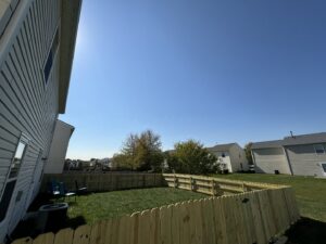 A newly installed wood privacy fence in a residential backyard by Central Ohio Fence in Newark, OH.