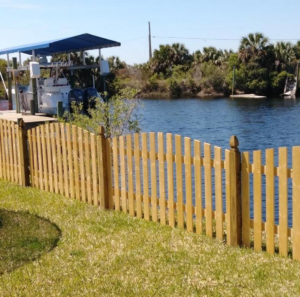 A new wood privacy fence installed in a residential backyard by Melanie K. Lynch in Crawfordville, FL