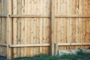 A newly installed wooden privacy fence, a service provided by St. Charles Fence & Deck Company in Saint Peters, MO.