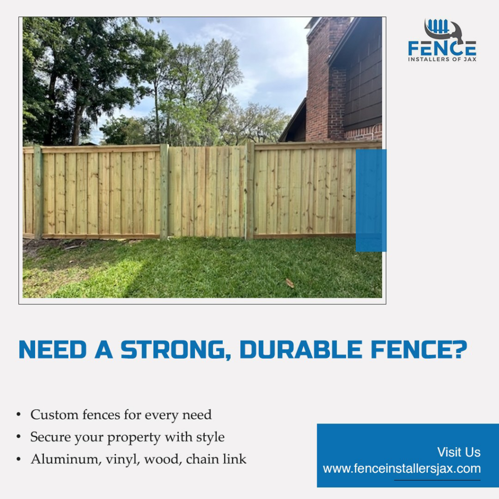 A newly installed wood privacy fence with a gate by Fence Installers of Jacksonville in Jacksonville, FL.