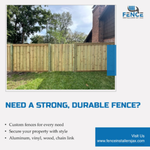 A newly installed wood privacy fence with a gate by Fence Installers of Jacksonville in Jacksonville, FL.