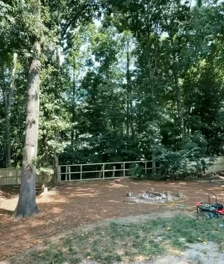 A newly installed wooden fence in a residential backyard by Heron Building Co in Franklin, TN.