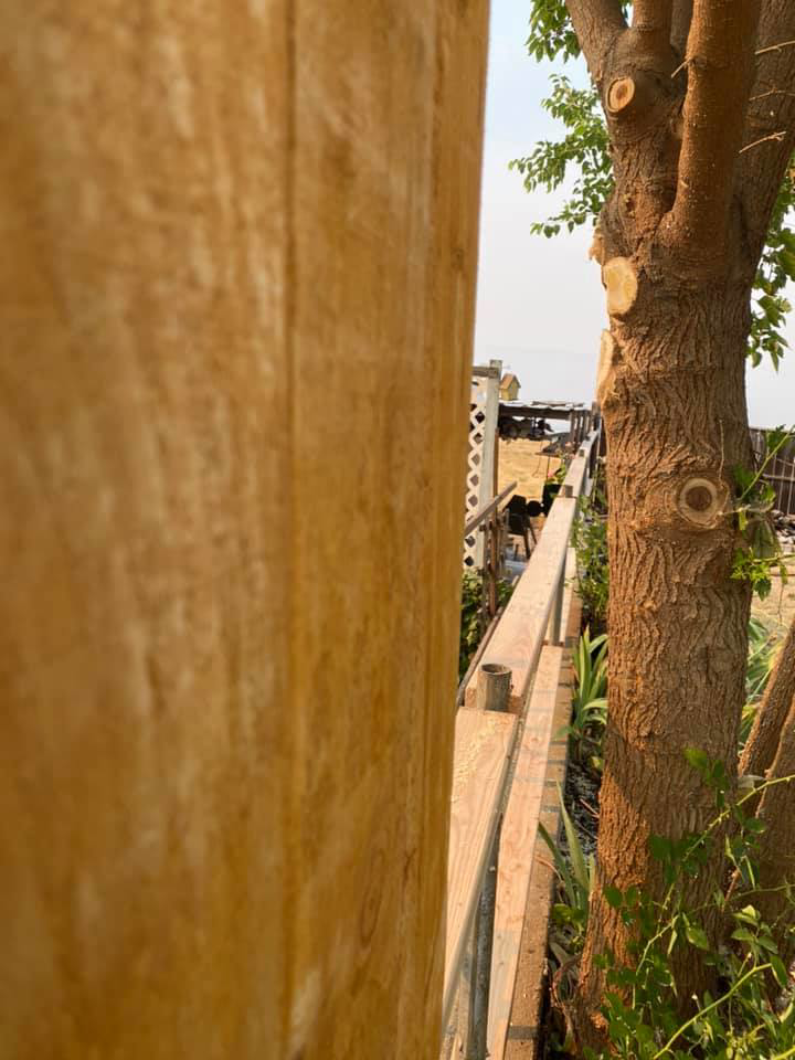 A close-up view of a newly installed wooden fence panel by Ram fence in Lewiston, ID