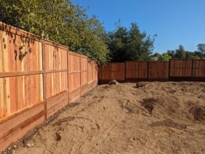 A new wooden privacy fence installed in a backyard by Sacramento Valley Fencing in Sacramento, CA.